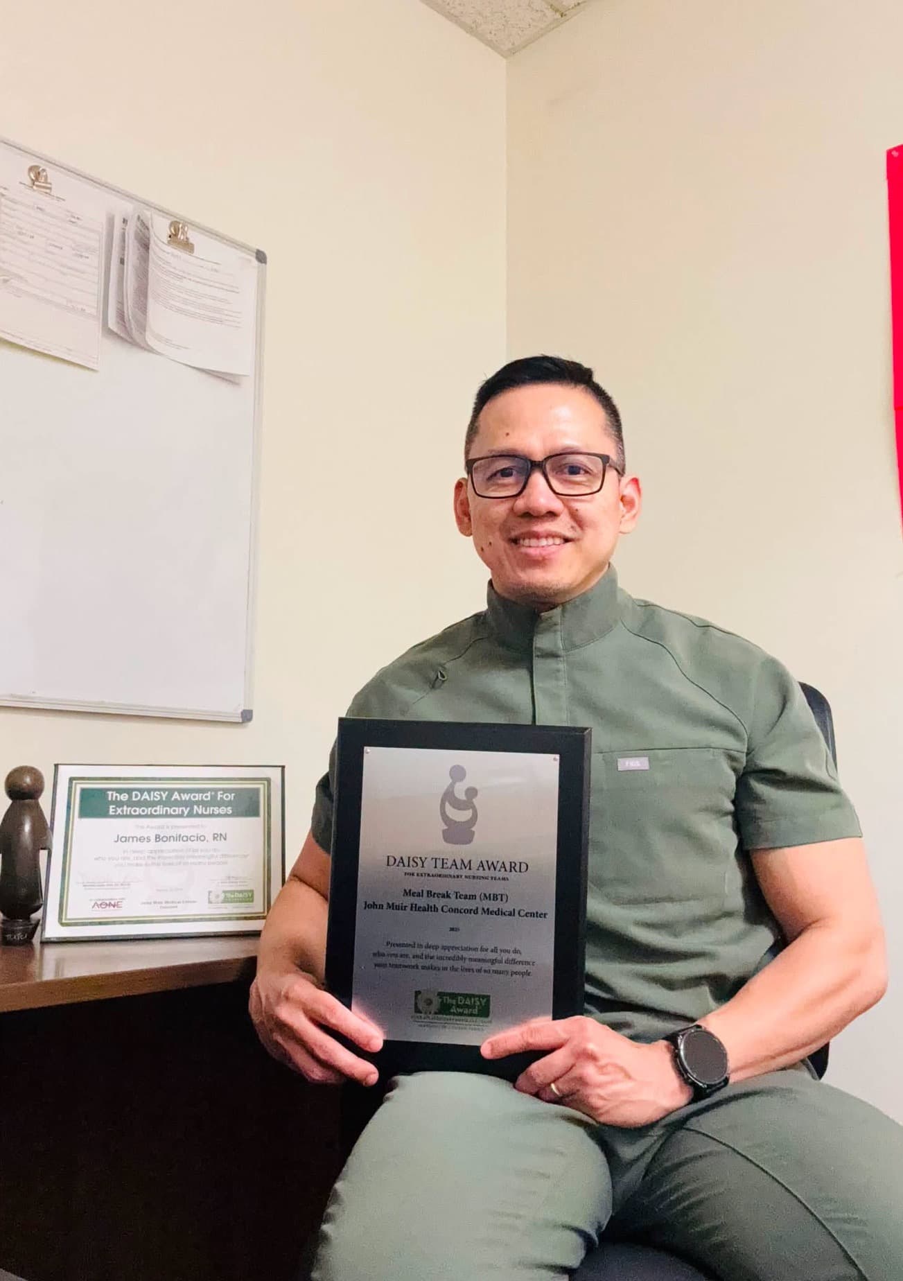 James Bonifacio holding his DAISY Team Award